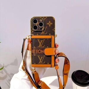 Louis Vuitton iPhone 14 Pro case. I have two available one comes with strap.
